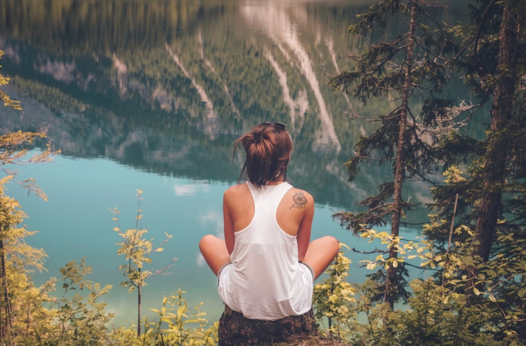 girl looking over a lake
