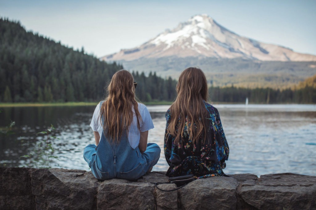 two girls by a lake