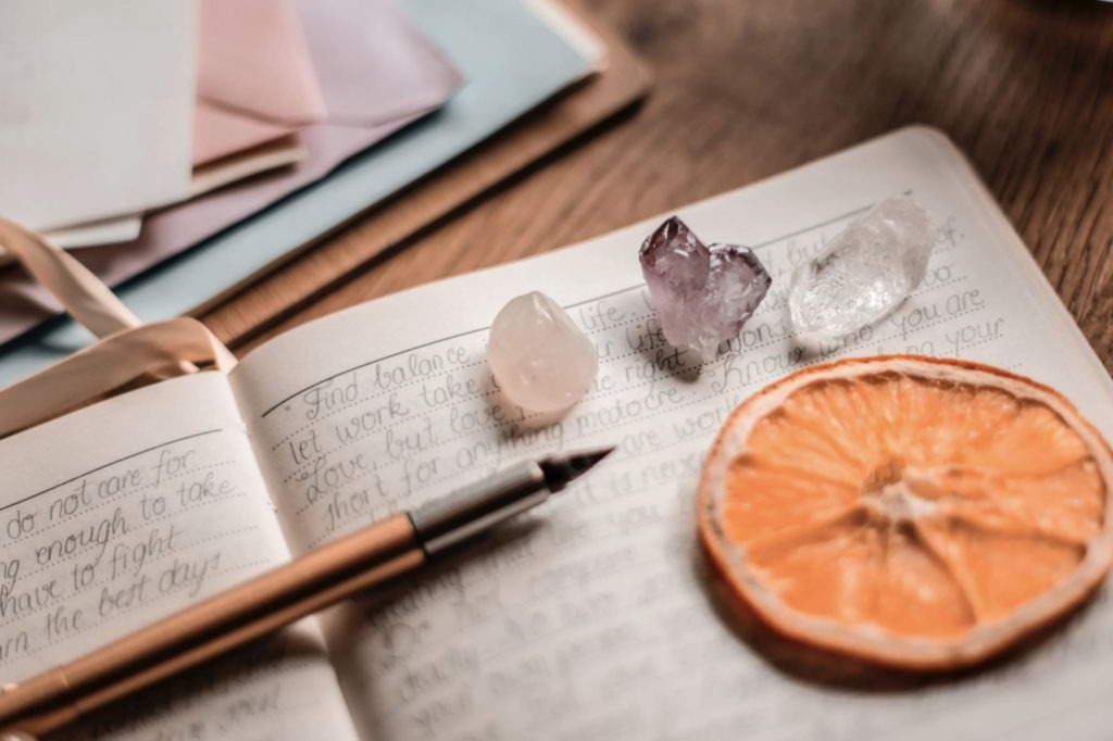 a journal and crystals
