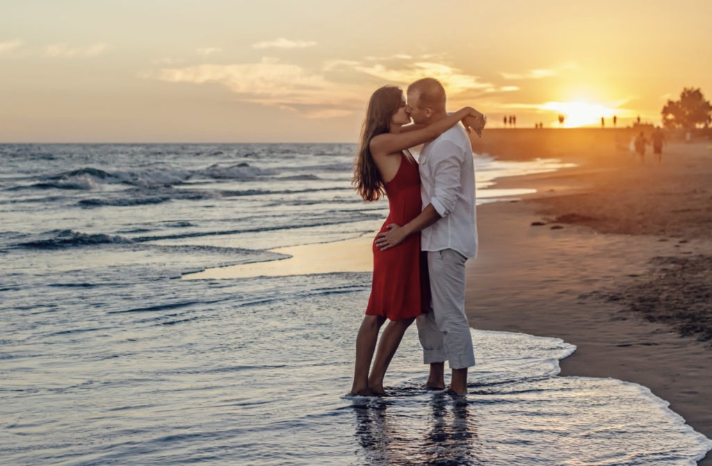 couple kissing on beach