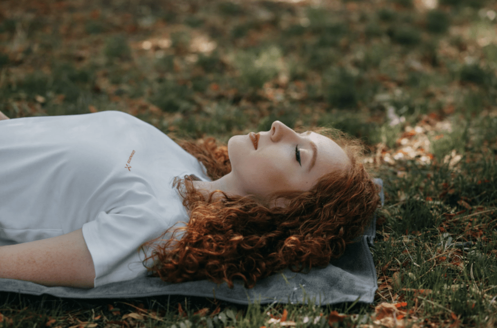 woman sleeping on the grass