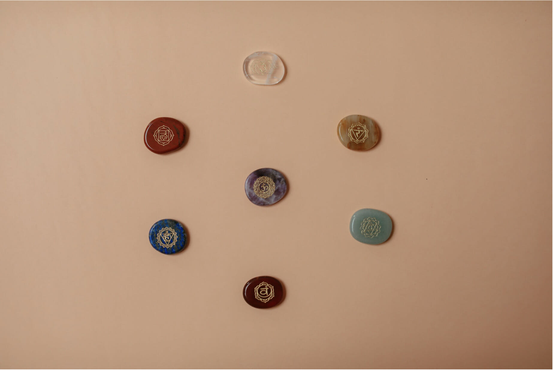 stones with chakra symbols 