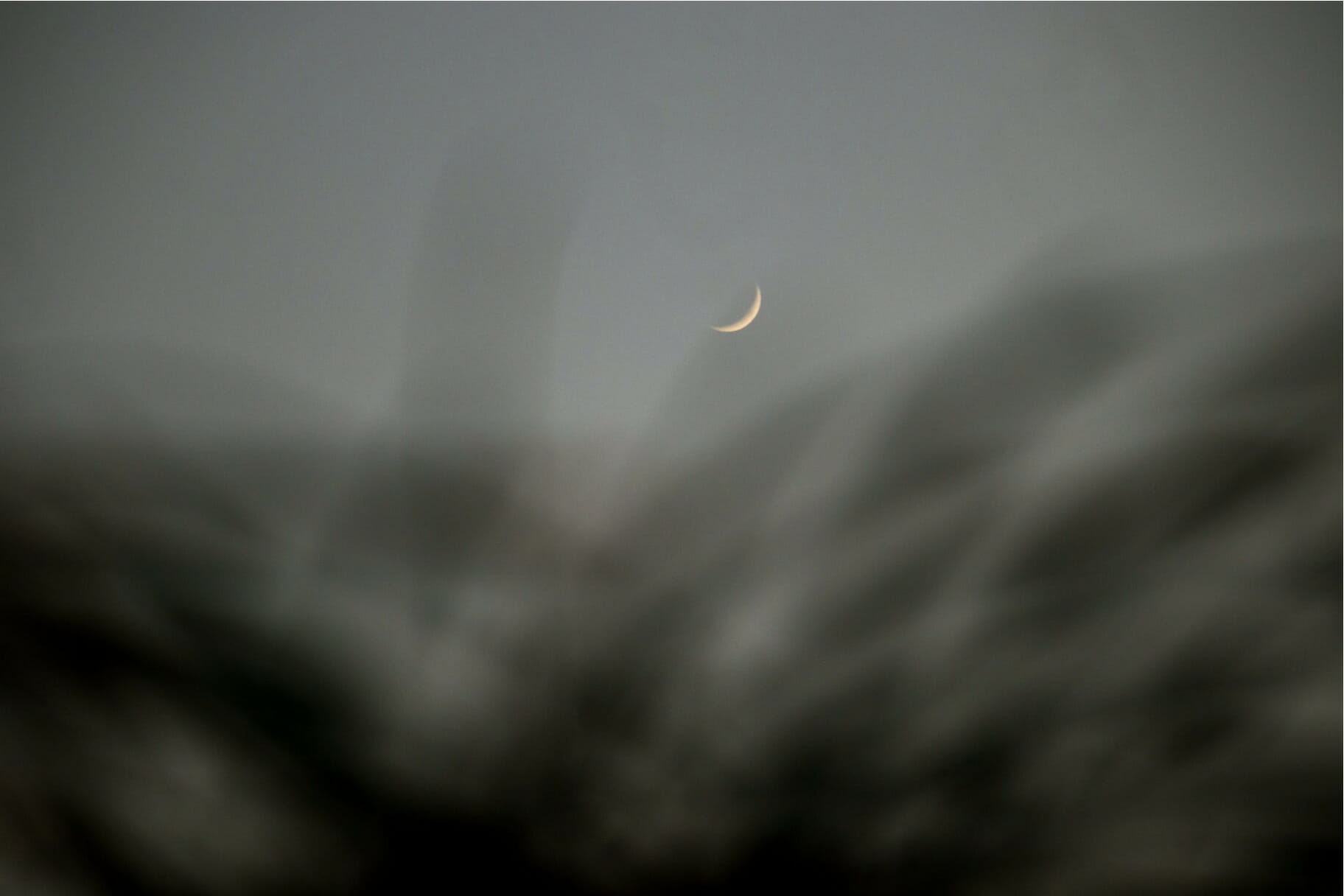 crescent moon in twilight sky