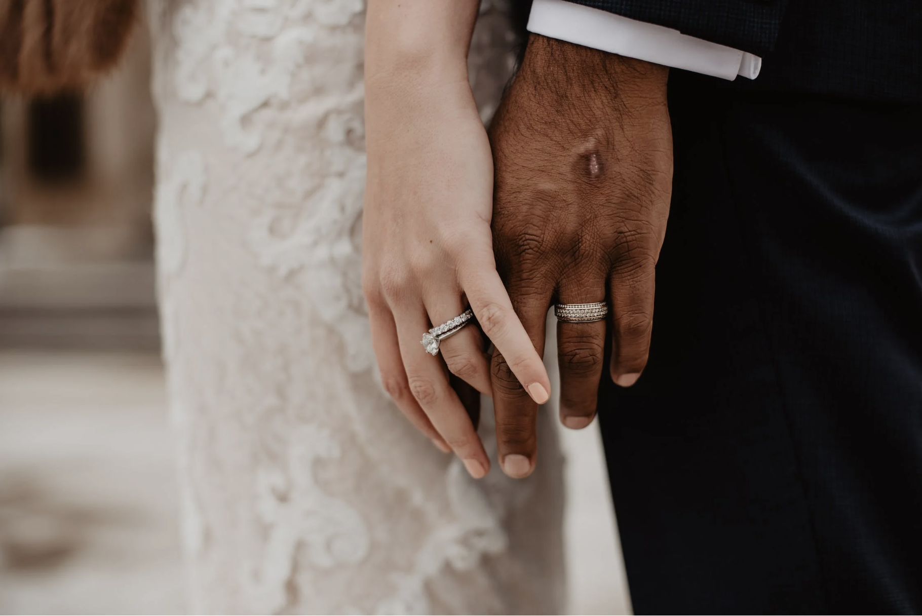 couple wearing wedding rings