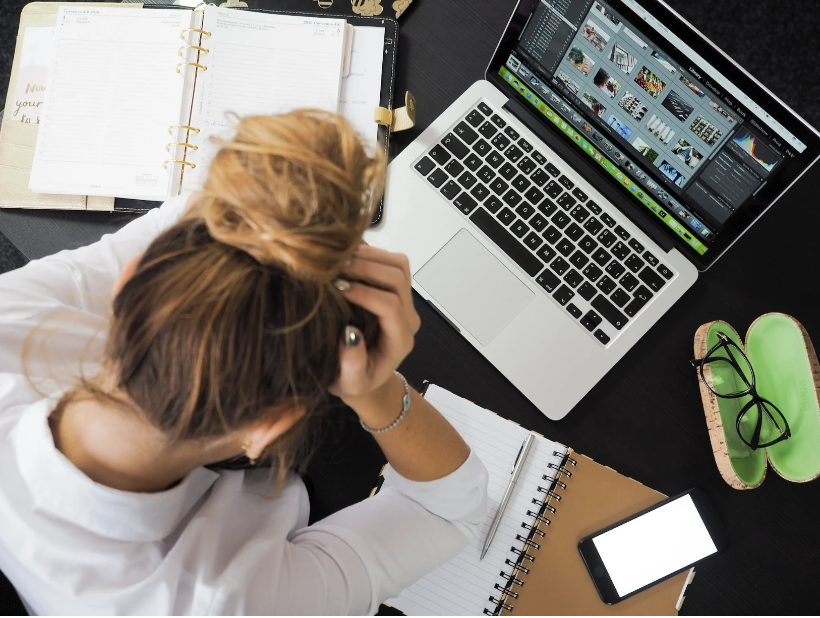 Woman getting stressed in front of her work desk